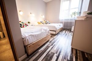 Za Murami Hostel客房内的一张或多张床位
