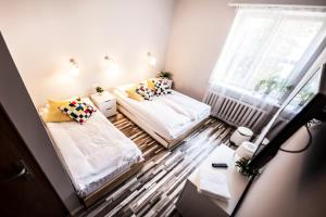 Za Murami Hostel客房内的一张或多张床位