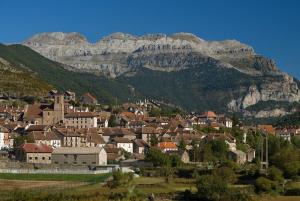 a small town in front of a mountain at Casa Rural Marín in Hecho