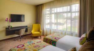 TV a/nebo společenská místnost v ubytování Tamarind Tree Hotel