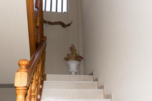 a stairway with a vase on the wall at Sunset Beach House in Kato Alepochori