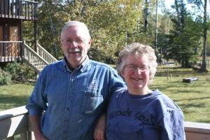 an older man and woman standing next to each other at Black Cat Guest Ranch in Brule Mines
