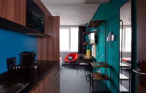 a hotel room with a blue and green wall at The Social Hub Amsterdam West in Amsterdam