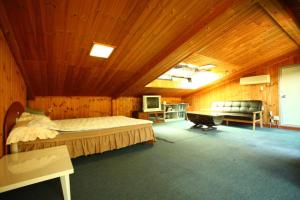 Postel nebo postele na pokoji v ubytování Bluesky Pension + 37 fotografií