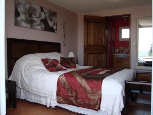 Letto o letti in una camera di Chambres d'hôtes Aux Portes de Bréhat
