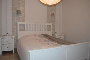 En eller flere senge i et værelse på Les Hauts de Chaudeyrac