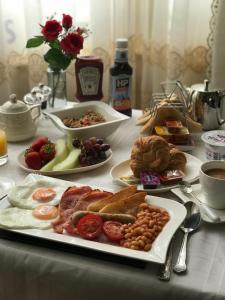 a table with plates of breakfast food on it at The Comat in Cleethorpes