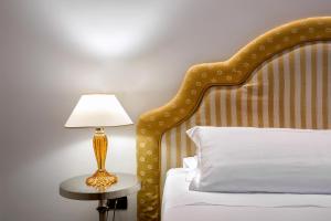Postel nebo postele na pokoji v ubytování Ca' San Giorgio B&B