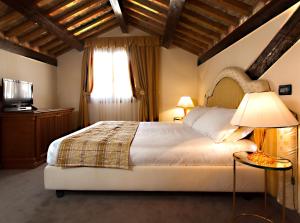 Postel nebo postele na pokoji v ubytování Ca' San Giorgio B&B