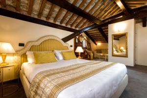 מיטה או מיטות בחדר ב-Ca' San Giorgio B&B