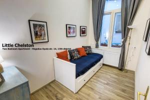 A bed or beds in a room at Little Americas Concert Hall Apartments