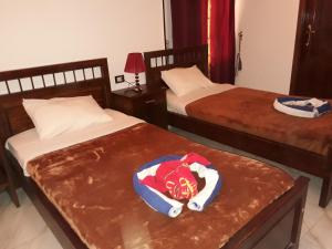 Postel nebo postele na pokoji v ubytování Al Hambra Hotel