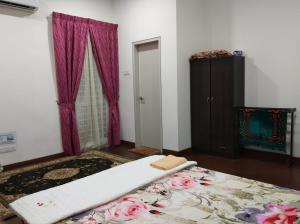 Postel nebo postele na pokoji v ubytování Masayu Putrajaya Homestay