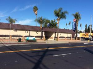 an empty street in front of a gas station at Stallion Motel Los Angeles in Los Angeles +13 photos