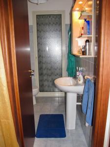 a bathroom with a sink and a toilet at Prato del Mare in Mascali