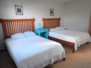 Cama ou camas em um quarto em Blue Coconut Cancun Hotel