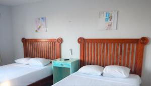 Cama ou camas em um quarto em Blue Coconut Cancun Hotel