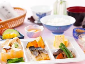 a plate of food with different foods on a table at Chofu Creston Hotel in Chofu