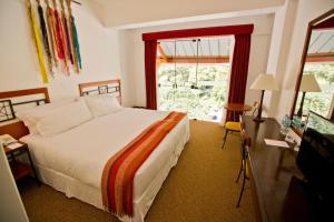 Postel nebo postele na pokoji v ubytování Tierra Viva Machu Picchu Hotel