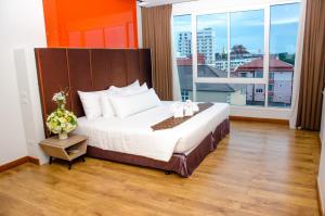 Ένα ή περισσότερα κρεβάτια σε δωμάτιο στο Prajaktra Design Hotel
