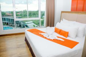 Ένα ή περισσότερα κρεβάτια σε δωμάτιο στο Prajaktra Design Hotel
