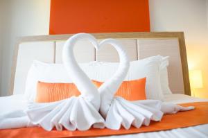 Ένα ή περισσότερα κρεβάτια σε δωμάτιο στο Prajaktra Design Hotel