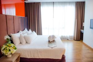 Ένα ή περισσότερα κρεβάτια σε δωμάτιο στο Prajaktra Design Hotel