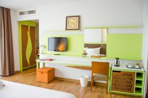 Ένα ή περισσότερα κρεβάτια σε δωμάτιο στο Prajaktra Design Hotel