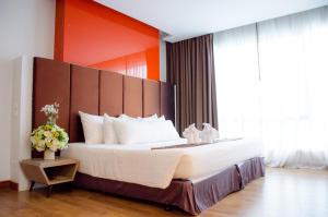 Ένα ή περισσότερα κρεβάτια σε δωμάτιο στο Prajaktra Design Hotel