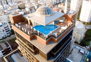 an overhead view of a building with a swimming pool at SKY Business Hotel in Antalya