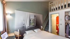 Postel nebo postele na pokoji v ubytování B&B HOTEL Agen
