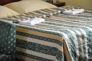 Postel nebo postele na pokoji v ubytování Hotel Terasa