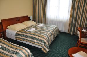 Postel nebo postele na pokoji v ubytování Hotel Terasa