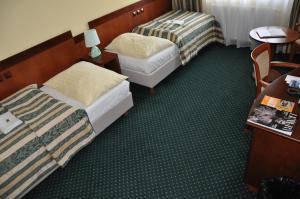Postel nebo postele na pokoji v ubytování Hotel Terasa