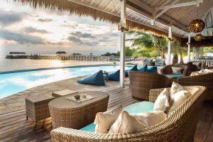 a resort with a pool and chairs and a table at Sudamala Resort, Seraya, Flores in Labuan Bajo