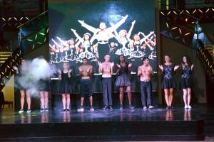 a group of people standing on a stage at Pickalbatros White Beach Resort - Hurghada in Hurghada