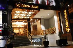 a building with a staircase in front of a hotel at Sabon Hotel in Addis Ababa