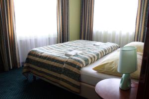 Postel nebo postele na pokoji v ubytování Hotel Terasa