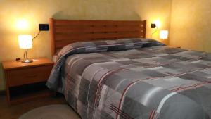 A bed or beds in a room at Agriturismo Taglio del Re