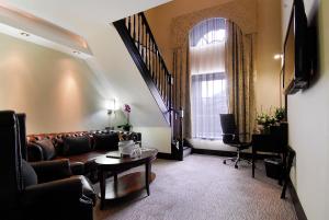 a living room with a couch and a table at Montcalm Brewery, London City in London