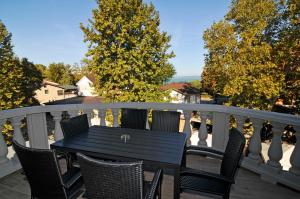 a black table and chairs on a balcony at Hotel Corso in Siófok