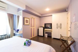 Postel nebo postele na pokoji v ubytování Lilac Relax-Residence