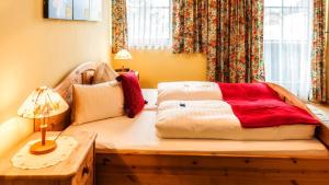 Letto o letti in una camera di Pension Gruber