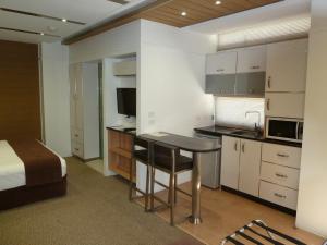 A kitchen or kitchenette at Moura Meridian Motel