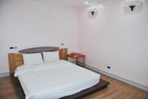 Voodi või voodid majutusasutuse Nice Hotel toas