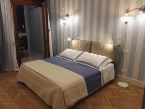 Postel nebo postele na pokoji v ubytování B&B Pescara Centro Luxury Suite