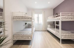 A bed or beds in a room at Chamberi Arrendamiento de Temporada