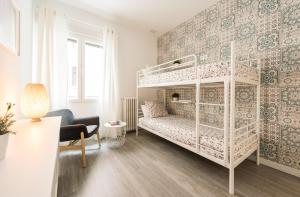 A bed or beds in a room at Chamberi Arrendamiento de Temporada