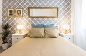 A bed or beds in a room at Chamberi Arrendamiento de Temporada