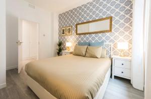 A bed or beds in a room at Chamberi Arrendamiento de Temporada